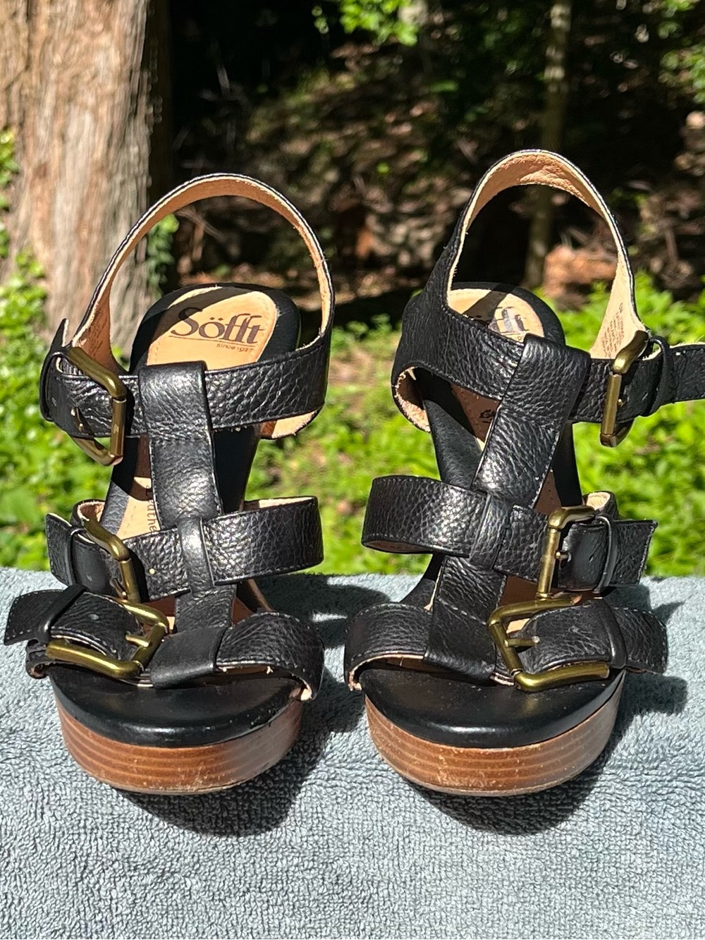 Sofft brand black leather strappy sandals, triple buckle, wooden platform heel.
